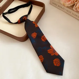 Elegant vintage fabric tie necklace featuring handmade orange flower embroidery and elastic strap