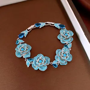 Elegant vintage silver bracelet featuring blue zircon roses and teardrop-shaped stones