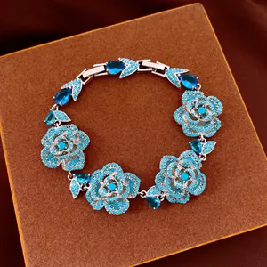 Vintage silver flower bracelet with sparkling blue zircons and pear-cut stones.