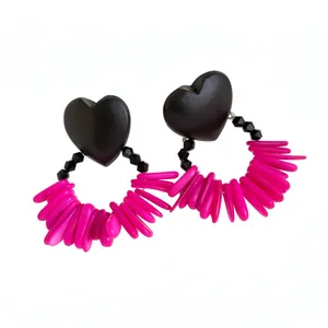 Vintage black heart-shaped wood earrings with vibrant pink shell tassels and beads
