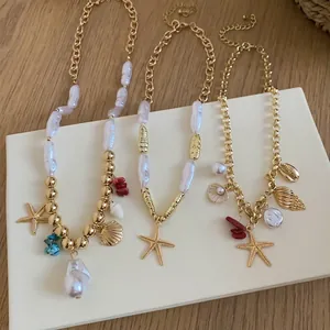 Set of three seaside vacation necklaces with starfish and shell pendants on white board