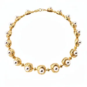 Vintage-style pearl necklace with gold-toned metal settings in a retro court design