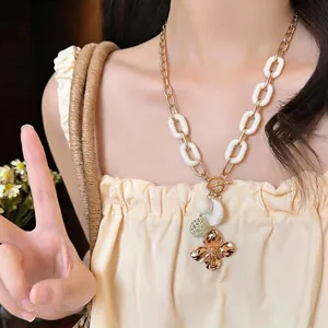Vintage gold flower pendant necklace with elegant white resin chain links for women