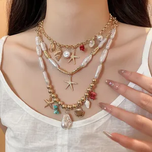 Close-up detail of multi-layered ocean themed necklace with starfish and pearl charms