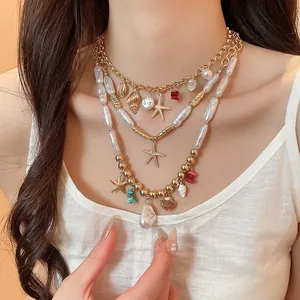 Close-up of layered beach necklace with starfish, shell charms, and pearls