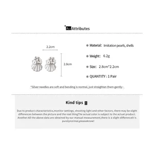 Detailed view of pearl shell earrings with size and material specifications