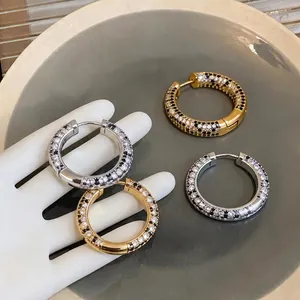 Elegant 18K gold plated hoop earrings with sparkling black and white zircon pave setting