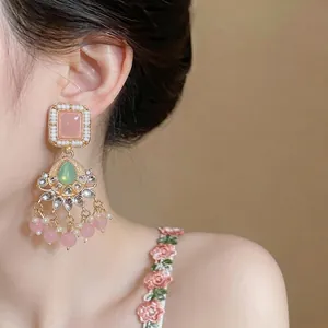 Elegant vintage style resin tassel drop earrings with pink stones and pearls