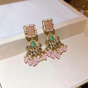 Elegant vintage style gold resin tassel earrings with pink beads and green accents