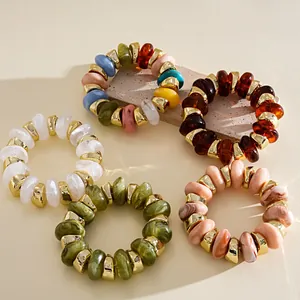 Close-up showing assorted acrylic beaded elastic bracelets in various retro stylish colors