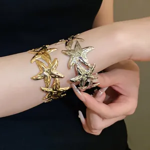 Elegant gold and silver metal starfish open cuff bracelets with a polished finish