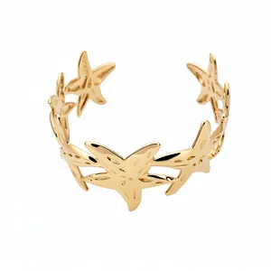 Elegant gold starfish open cuff bracelet for women featuring a minimalist ocean design