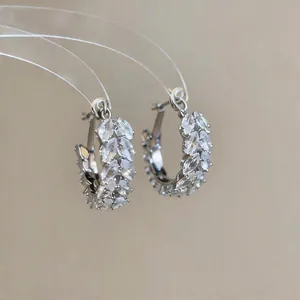 Macro view of marquise-cut zirconia stones arranged in a wheat-ear pattern hoop