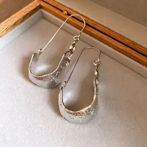 Modern U-shaped silver pendant ear hooks with unique hammered texture