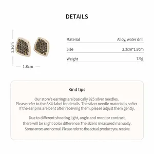 Detail view of vintage rhombic earrings with dark rhinestones and size specifications.