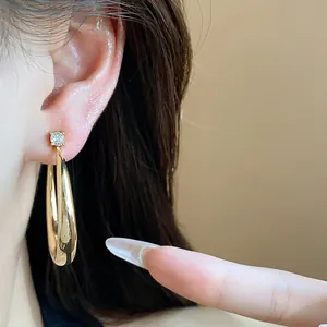 Close-up detail showing the wear effect of 18k gold plated hoop earring with zircon
