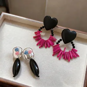 Elegant acrylic heart and flower drop earrings set in vintage wooden jewelry box