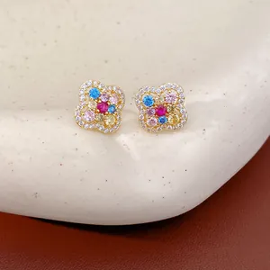 Detail view of colorful zircon clover flower stud earrings featuring elegant 14k gold plating