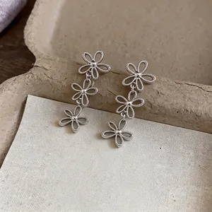 Minimalist silver hollow flower drop earrings with a Korean-inspired design for women.