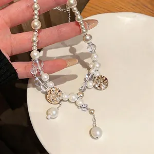 Light luxury pearl necklace with floral printed gold charms and clear beads decoration