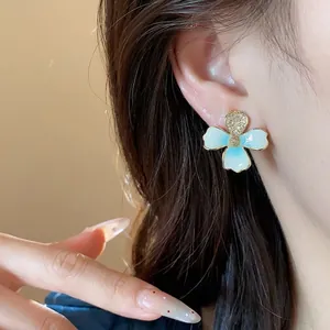 Elegant 18k gold plated flower stud earrings with light blue enamel and zircon