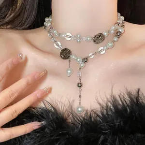 Detailed view of a vintage-style double-layered pearl and silver beaded choker necklace