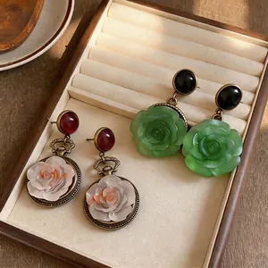 Elegant vintage resin rose pendant earrings with silver needles in floral design
