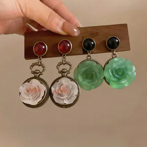 Vintage style resin flower drop earrings with bronze finish and colorful floral details