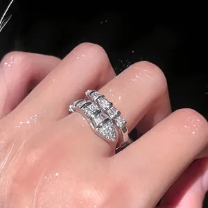 Detailed close-up showing the sparkling square zircons on this silver snake shaped open ring