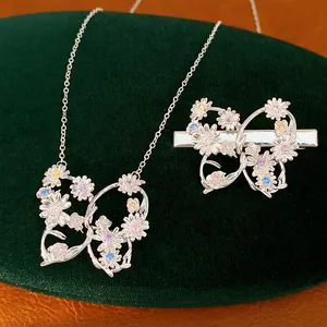 Macro detail of exquisite vintage butterfly hair clip and necklace with zircon flowers