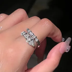 Close-up of a silver snake-shaped ring with pavé-set sparkling cubic zirconia