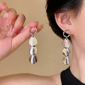 Minimalist silver needle metal earrings with three glossy teardrop shaped drops