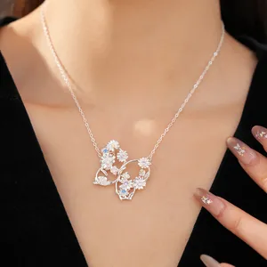 Detailed view of butterfly necklace with flower patterns and colorful zircons