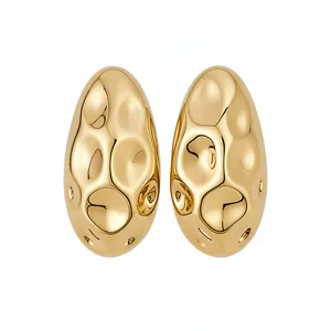 Elegant vintage gold hammered oval stud earrings with a unique textured metallic finish