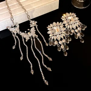 Luxurious crystal butterfly tassel necklace and earring set for elegant wedding banquets.