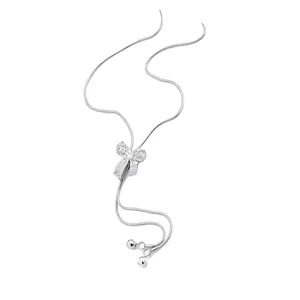 Elegant silver-toned zircon hollow bow necklace with adjustable snake chain for women