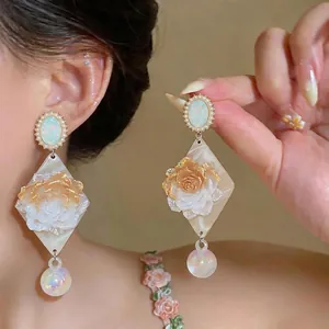Elegant resin rose drop earrings with pearl border and iridescent ball dangle