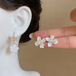 Elegant French style camellia pearl drop earrings with zircon bow detail for women