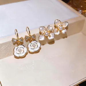 Elegant French style white camellia pearl drop earrings with bow and zircon accents