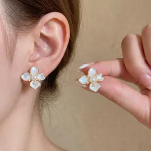Elegant French style camellia flower earrings with white pearl center and zircon accents