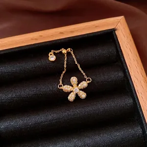 Elegant vintage gold chain ring featuring a floral design with pavé zirconia crystals