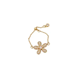 Vintage gold-toned flower chain ring featuring pavé crystal stones and adjustable link band.