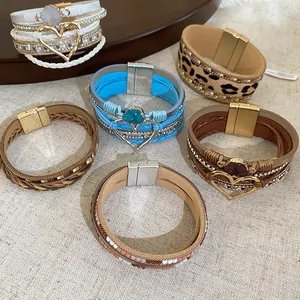 Close-up of Bohemian multi-layer leather bracelets with magnetic clasps and heart charms