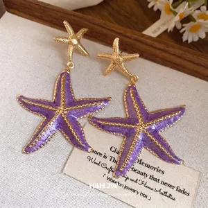 Elegant vintage purple enamel starfish pendant earrings with golden finish for beach vacation