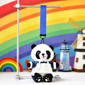 Close-up of a cute panda plush doll in a blue hoodie with a matching blue lanyard