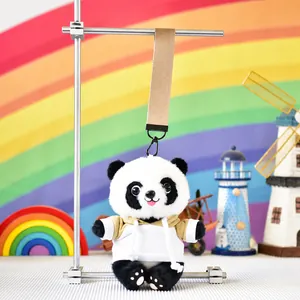 Close-up of a cute panda plush doll wearing a hoodie with a tan colored fabric lanyard