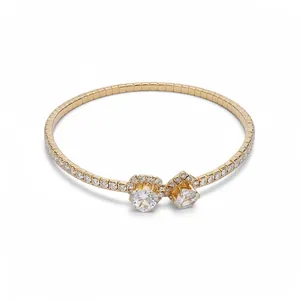 Elegant gold-tone open bangle with heart and round diamond accents
