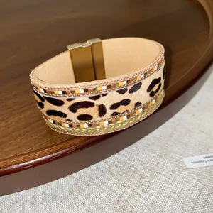 Detailed view of bohemian leopard print leather bracelet with gold magnetic clasp