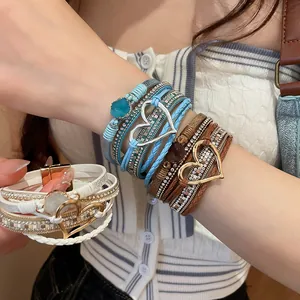 Close-up of bohemian multi-layer woven leather magnetic bracelet with heart charms