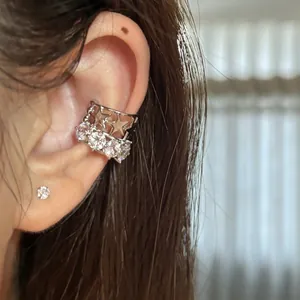 Close-up of zircon star ear cuff showing detailed silver finish and crystal shine